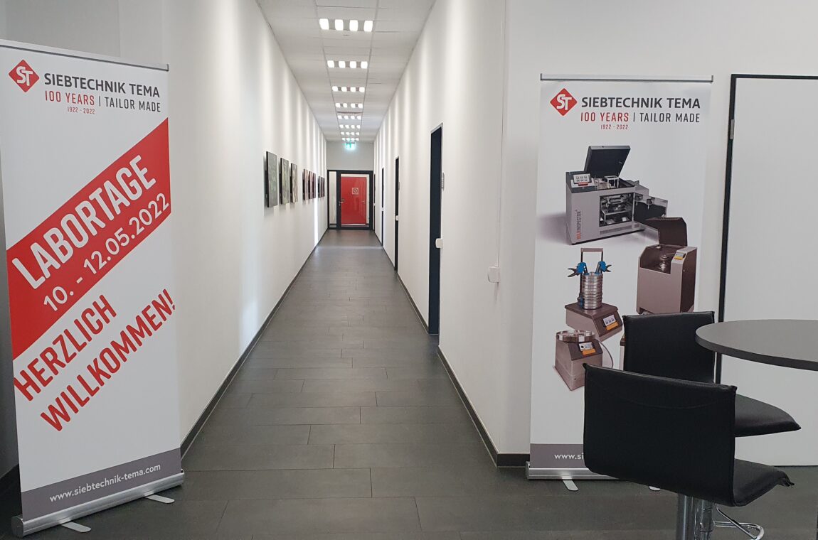 Entrance to the conference floor with a view of the corridor and our welcome banner